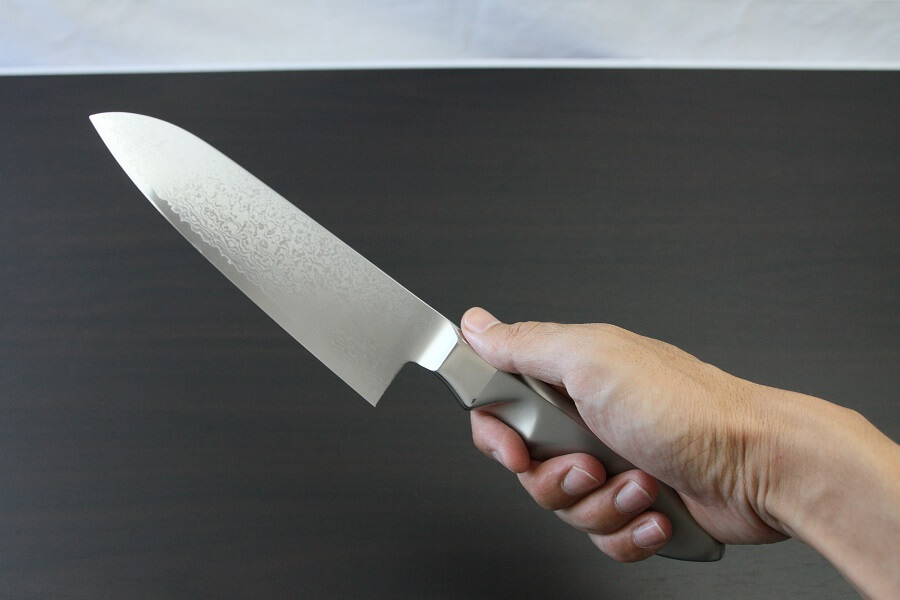DamMona_Santoku_08 Japanese Chef Knife, Damascus Santoku Multi-purpose, grabbed by hand