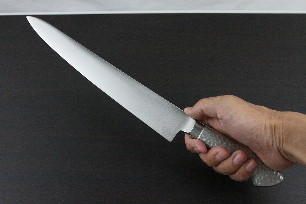 elemon_sujihiki270_08 Japanese Chef Knife, Elegance Monaka Series, Sujikiri slicing knife 270mm, grabbed by a man's hand