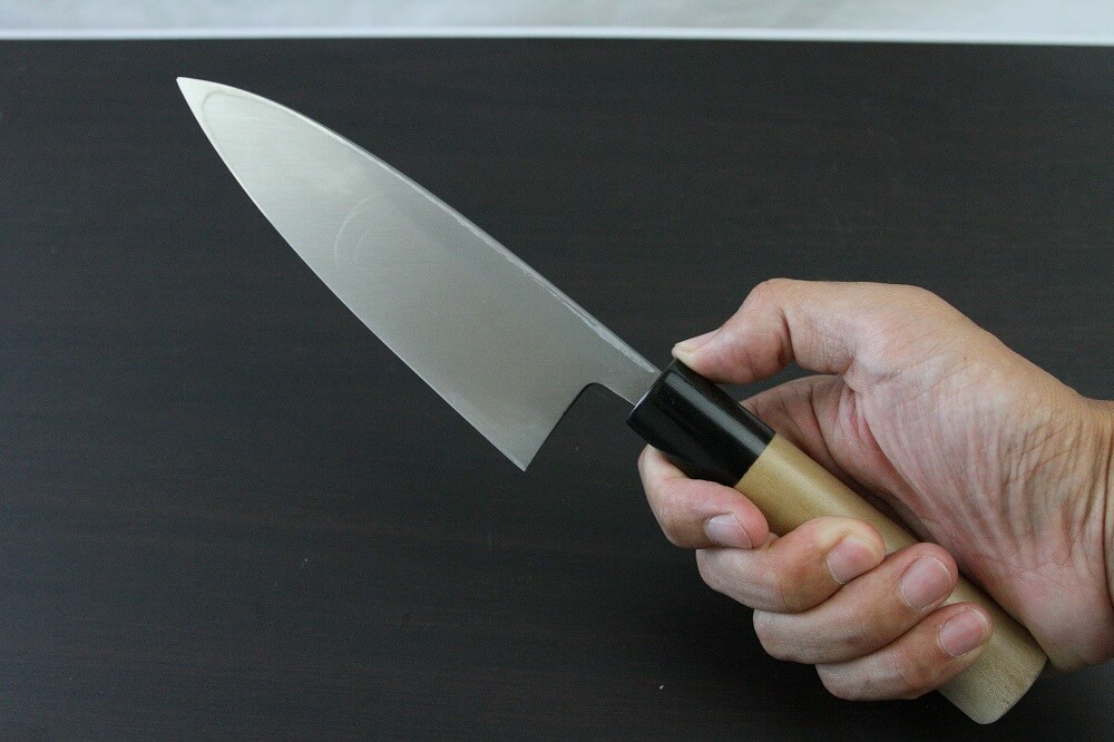 1st_deba_150_IMG_6554 Japanese professional chef knife, Deba fillet knife, steel 150mm, grabbed by a man's hand