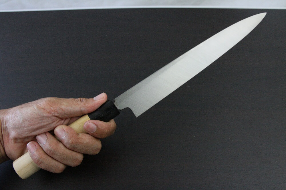 1st_yanagiba_left_240_IMG_6561 Japanese professional chef knife, left-handed Yanagiba Sushi knife, 1st grade 240mm, grabbed by a man's hand