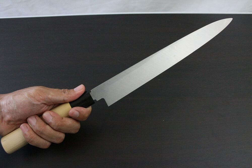 1st_yanagiba_left_270_IMG_6562 Japanese professional chef knife, left-handed Yanagiba Sushi knife, 1st grade 270mm, grabbed by a man's hand