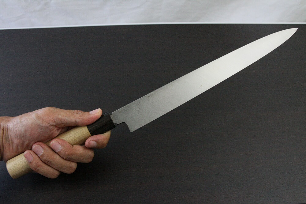 1st_yanagiba_left_300_IMG_6563 Japanese professional chef knife, left-handed Yanagiba Sushi knife, 1st grade 300mm, grabbed by a man's hand