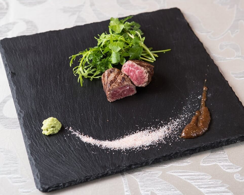 Wagyu Japanese beef, an excellent Japanese cuisine, serving steak on a beautiful black plate