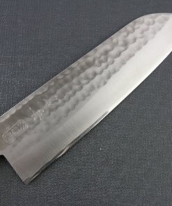 Toshu Santoku multi-purpose Japanese chef's knife, hammered finish blade and mahogany handle, details of blade front side